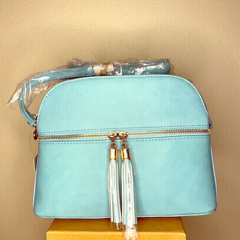 Turquoise bag with tassels